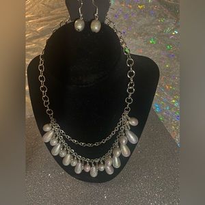 Beautiful 2 strand necklace with iridescent beads with earrings.